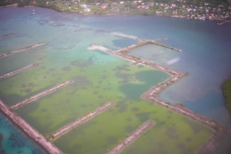 An aerial view of Ashton Lagoon in 2004 shows how the failed marina disrupted the natural water flow. (Photo by Michele Kading)