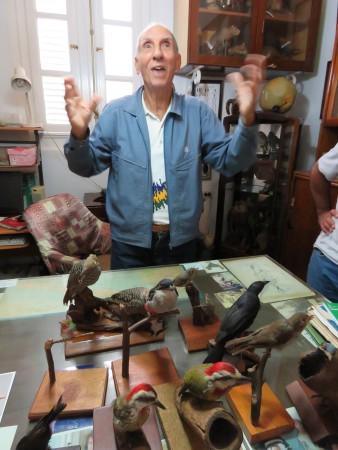 Emeritus ornithologist and living legend, Orlando Garrido, sharing stories from the field while showing us his endemic bird collection (Photo by Susan Jacobson)
