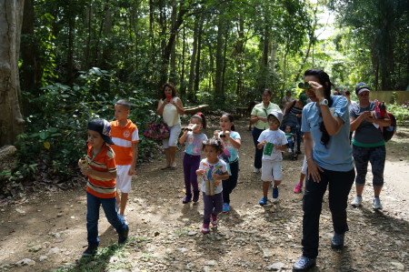 On the trail looking for birds with home-made binoculars in Puerto Rico. (Photo courtesy of Centro Ambiental Santa Ana/ Sociedad de Historia Natural de Puerto Rico)