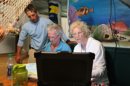 Logistical planning with Capt Duke, Margo, and 1st mate Andrew. (Photo © Conservian/ Scott Hecker)