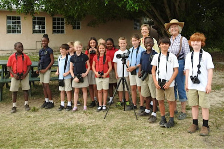 Year 5 class at Lucayan International School observing and studying birds at the school grounds. (photo by Erika Gates)