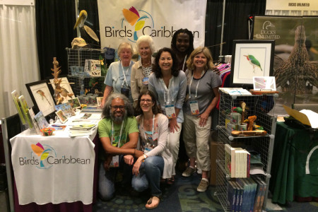 Our Caribbean flock gathers at our BirdsCaribbean booth, a popular spot in the Exhibition Hall - Kate Wallace, Erika Gates, Lisa Gates, Lisa Sorenson, Wayne Smart, Jennifer Wheeler, Howard Nelson and Ellie Devenish.