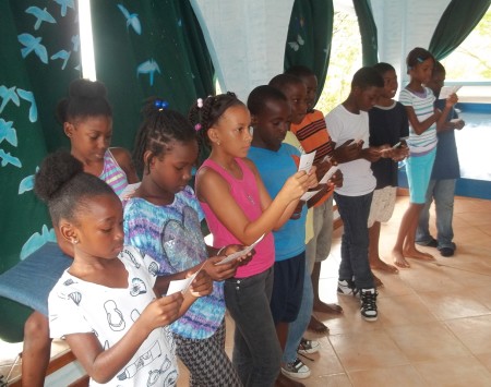 Children learn about the challenges of migration and breeding successfully in the Bird Survivor game, part of the BirdSleuth Caribbean curriculum. (photo by Marina Fastigi)