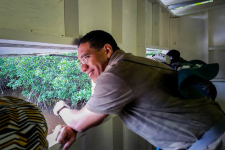 Jamaican Prime Minister Andrew Holness in the bird-watching hide at the Caribbean Coastal Area Management Foundation's (C-CAM) Wetland Information Centre in the Portland Bight Protected Area. The hide is dedicated to the late Jamaican ornithologist Robert Sutton. (Photo: C-CAM)