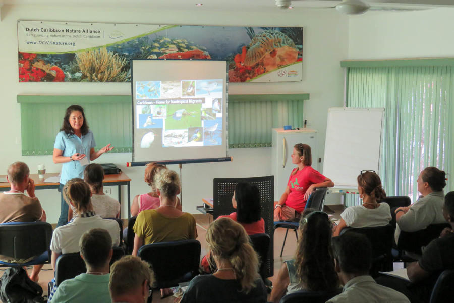 Lisa Sorenson, Executive Director of BIrdsCaribbean, talks about the many migratory and resident birds that can be found on Bonaire. (photo by Holly Robertson)