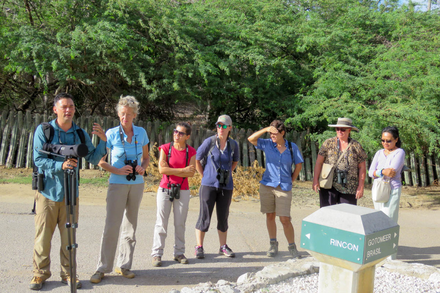 Trainer Rick Morales explains how to guide a group on a trail before the morning birding walk at Dos Pos. (photo by Lisa Sorenson)