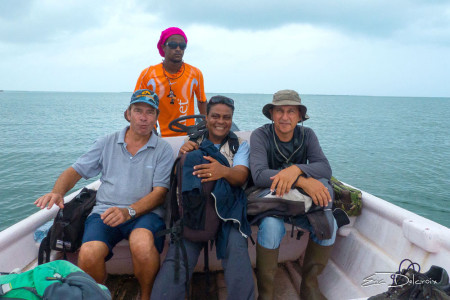 The boat captain (in the back), the airplane pilot, Frantz Delcroix, and Anthony Levesque as they set out for Codrington Lagoon (Photo by Eric Delcroix)