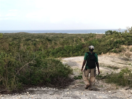 Lenn Isidore looking out over the coastal scrub near Two Foot Bay (Photo by Jeff Gerbracht)