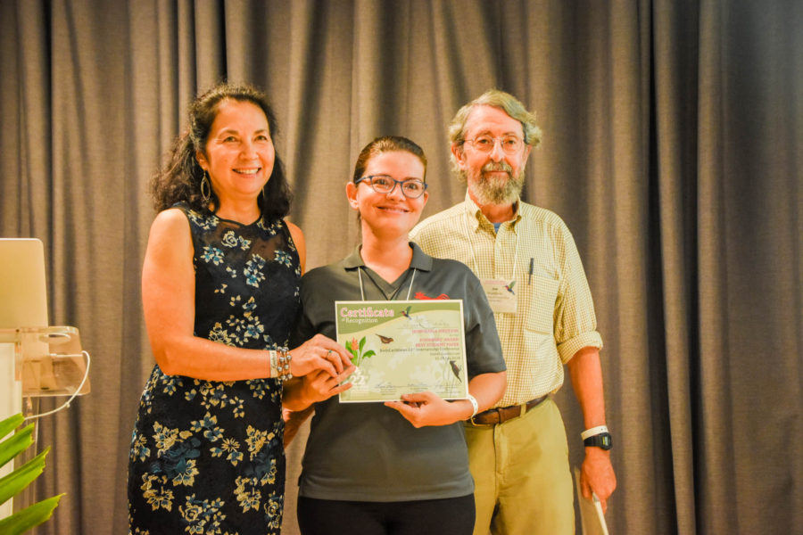 Laura Fidalgo (center) accepts an Honorable Mention Founders' Award for her work with the Elfin-woods Warbler in Puerto Rico. (photo by Mark Yokoyama)