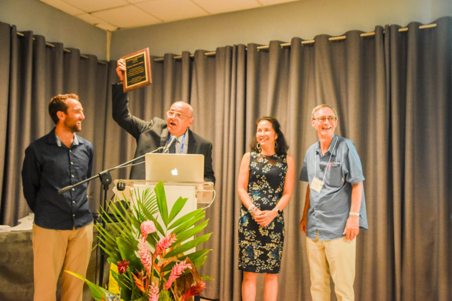 Maurice Anselme (with plaque), the Director of the Parc National de la Guadeloupe, dedicates his Lifetime Achievement Award to all the staff of his national park.