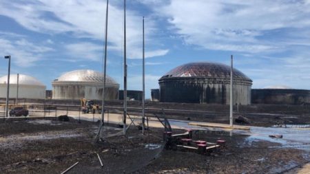 The oil tanks at the Equinor South Riding Point oil facility in High Rock, Grand Bahama, were severely damaged, causing a large spill. (photo by Sam Teacher)