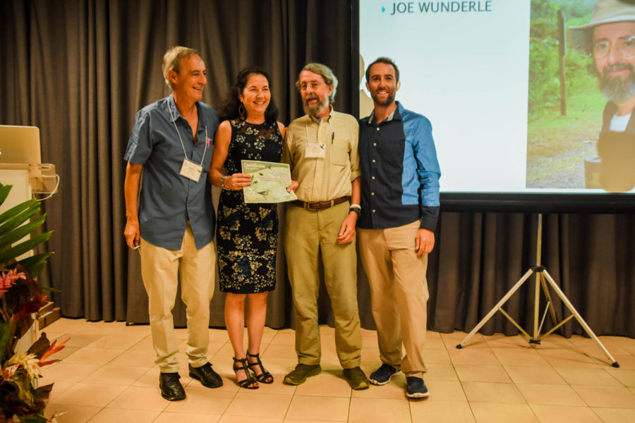 Joe Wunderle (second from left) receives the one and only Site Fidelity Award for being the longest running BirdsCaribbean member — 30 years and going strong! (photo by Mark Yokoyama)