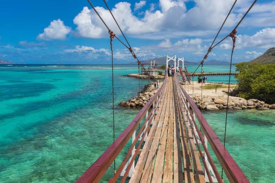 New suspension bridge over breached gap in failed marina causeway, Ashton Lagoon, Union Island, St. Vincent and the Grenadines