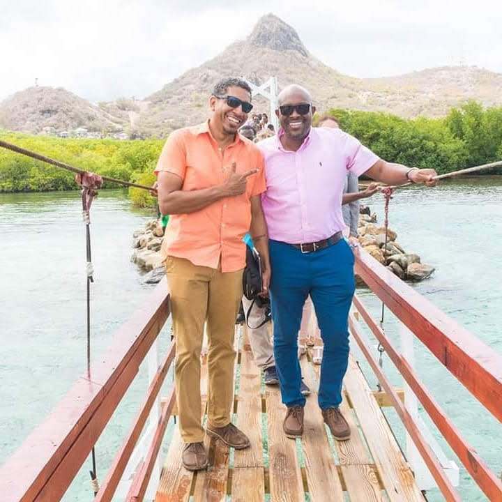 Hon Camilo Gonsalves and Hon Saboto Ceasar on the suspension bridge at Ashton Lagoon