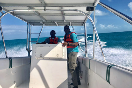 Conservation Officers Rodney Smith and Trevor Watkins of DECR assisting with access to islands for shorebird surveys