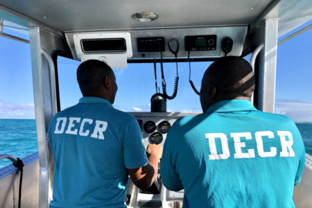 DECR Conservation Officers Rodney Smith and Delroy Glinton assisting with access to islands for shorebird surveys