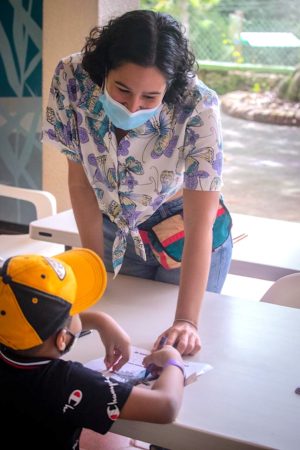 Biologist working with child