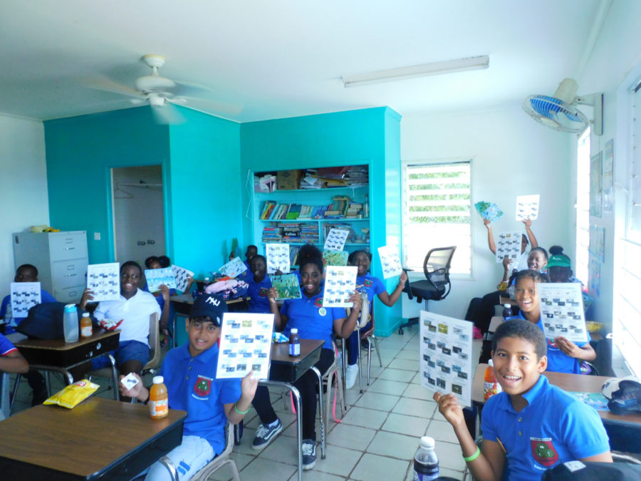 Students of Grade 6 class showing their shorebird identification cards after their field trip Credit: Thiffanie Williams