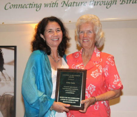 Erika receives a life achievement award from Lisa for her outstanding contributions to bird conservation.