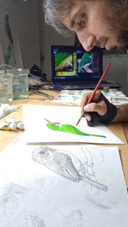 Artist, Arnaldo Toledo, at work.