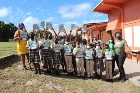 Students at the New Winthorpes Primary School show off their new Into The Wild Booklets.