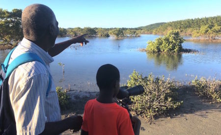 Junior Prosper and son out birding, Antigua and Barbuda. 