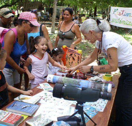 Dr. Lourdes Mugica and the Bird Ecology Group share educational materials on birds with the local community and children, Caribbean Endemic Bird Festival.