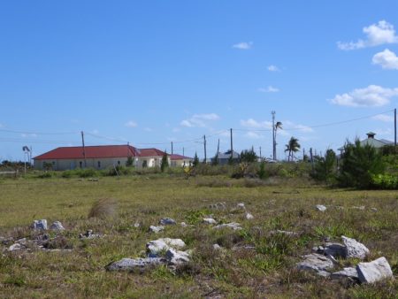 Pelican Point rebuilds, church in foreground.