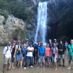 Group photo at Baiguate Waterfall, Dominican Republic.