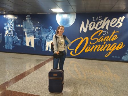 The nights of Santo Domingo is shown on a backdrop at the airport.
