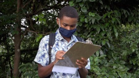 Youth learning how to count St. Vincent Parrots.