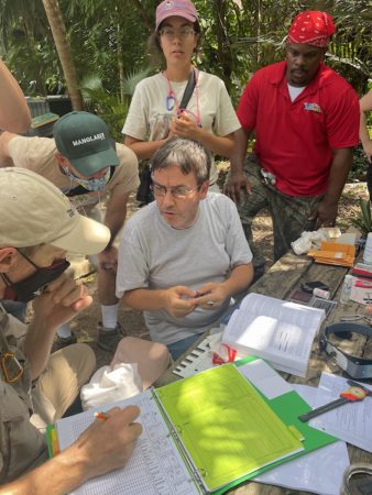 Workshop Facilitator, Juan Carlos Fernandez, explains bird banding basics.