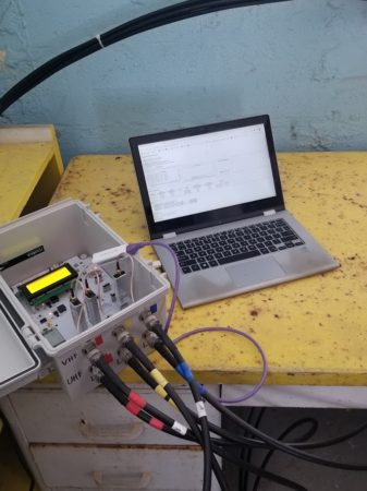 Labeled coaxial cables have been connected to the SensorStation receiver, which is then tested and deployed to begin collecting data.