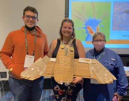 Participants in the Raptors of the Caribbean Workshop show off their creation, made from recycled materials.