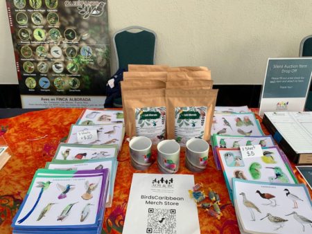 Various items for sale at the BirdsCaribbean merchandise table.