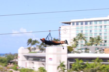 Justin Ziplining across the Convention Center courtyard.