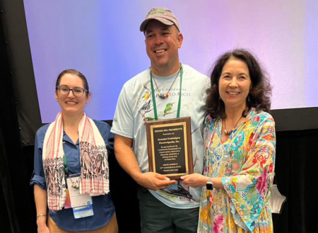 Ex-President of the Sociedad Ornitológica Puertorriqueña, Inc. (SOPI), Gabriel Lugo, receives the BirdsCaribbean President's Award on behalf of SOPI President, Laura Fidalgo, and Executive Director Emilio Font