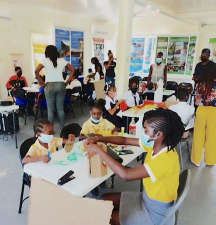 Infants and primary school students create bird crafts as part of the 2022 CEBF activities, Jamaica.