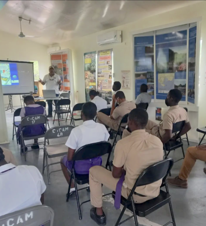Presentation being given by Caribbean Coastal Area Management (CCAM) staff to secondary school students in Jamaica.