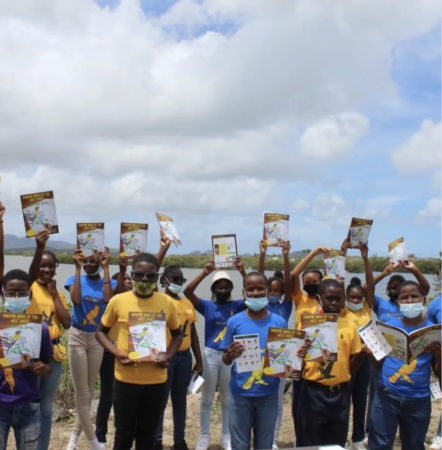 Students of Gospel Light Academy with their copies of the Endemic Birds colouring book, Antigua. (Photo by the Environmental Awareness Group)
