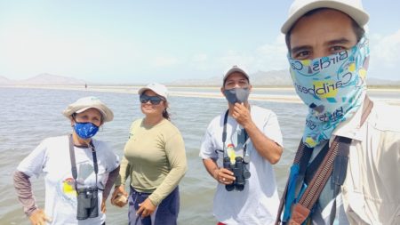 A group photo of Josmar and other members of his team in the lagoon on Margarita Island.