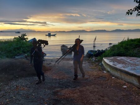 Birders with scopes at sunset