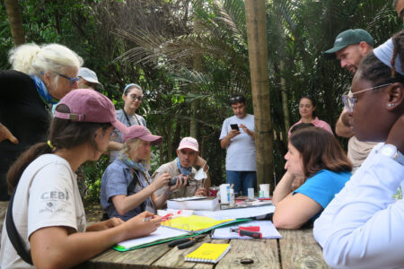 Bird banders around a table