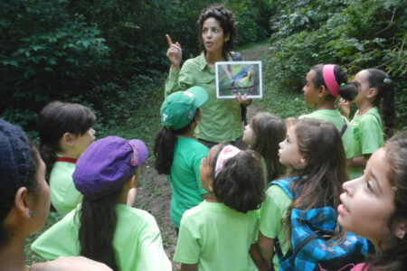 Dayamiris birdwatching with Girl Scouts.