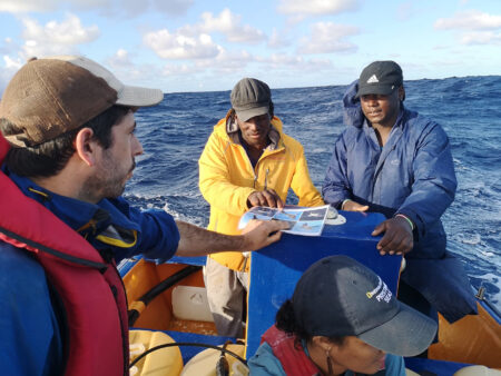 Yvan Satge discusses birds at sea with fishermen