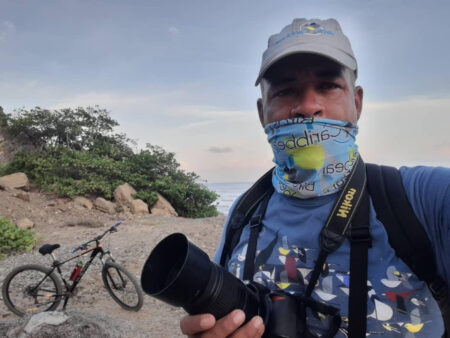 A Cuban birder selfie with their bike