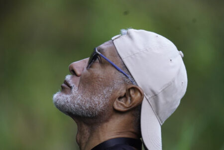 Jamaican man looking for birds
