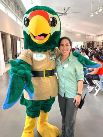 Yaritza with Lola the Puerto Rican Parrot mascot.