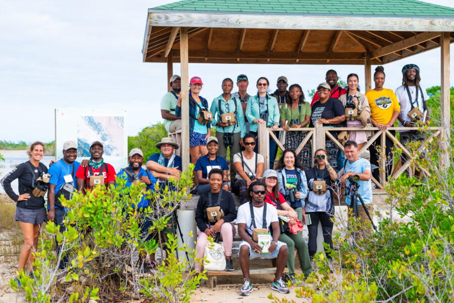 Boat Captains, Ecotour Guides, Educators, Journalists, Media Professionals, Government Officers, Policy Makers and more! Our Caribbean Birding Trail, Turks and Caicos Isands cohort featured a diverse group, all connected by their passion for meaningful, sustainable tourism and nature conservation in TCI. Participants and Facilitators pose for a shot at Wheeland Pond. Twenty people were from TCI, three from The Bahamas, and one from Puerto Rico. (photo by Christel Mohammed)