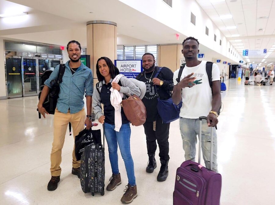 Photo of group of people in an airport.